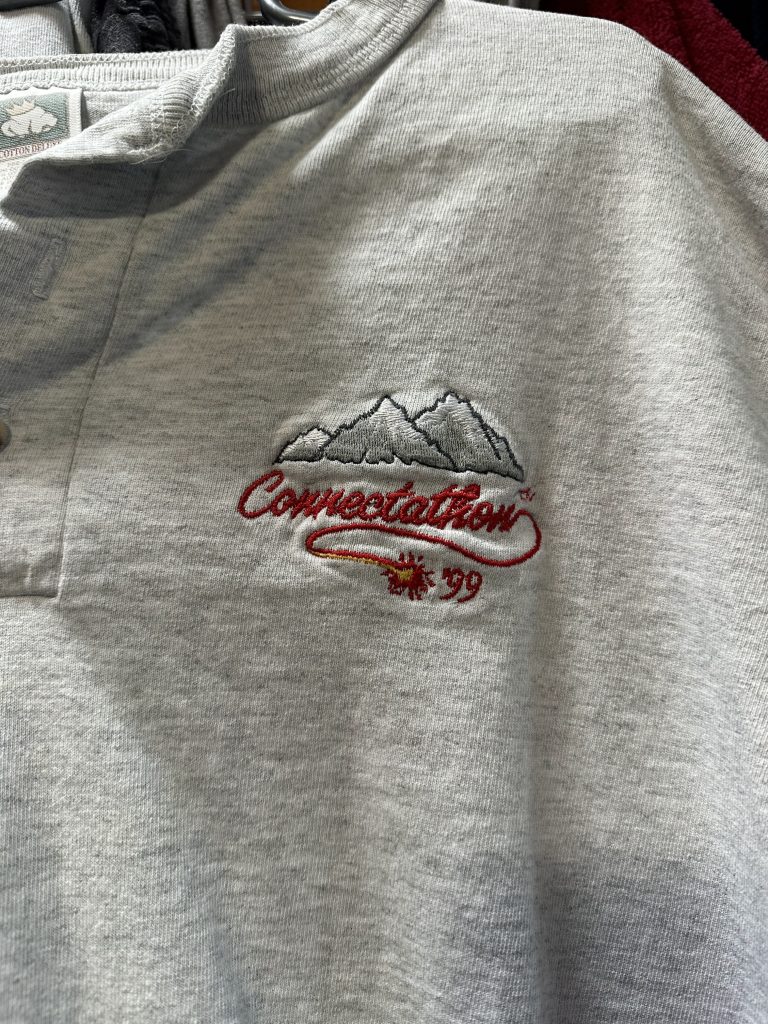 Grey shir with a logo with mountains and "Connectathon '99"